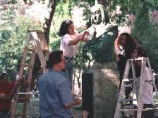 Seminar participants clean Stuyvesant sculpture